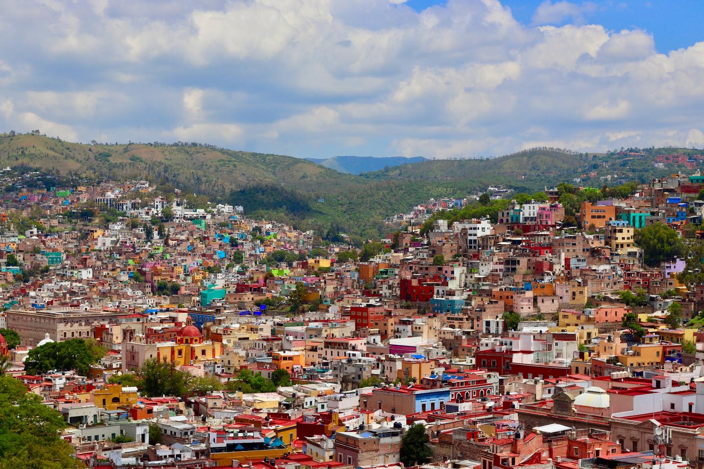 The colorful mountain terrain of Guanajuato City homes flourish on a summer Mexican afternoon. Viva Mexico.; Shutterstock ID 1454965814; purchase_order: Martin Zoffmann